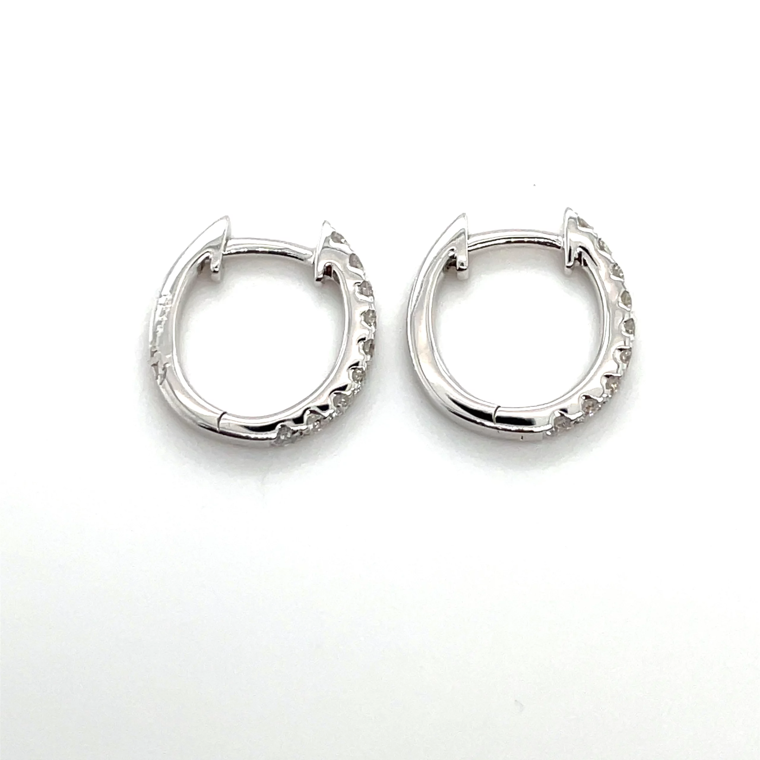 oval hoop earrings with diamonds side view from donna jewelry company chicago